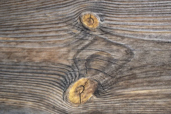 Old wooden planed board surface with knots and cracks, may be used as background