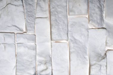 Beyaz tuğla duvar plastik paneli dikey odaklı, arka plan veya doku olarak kullanılabilir