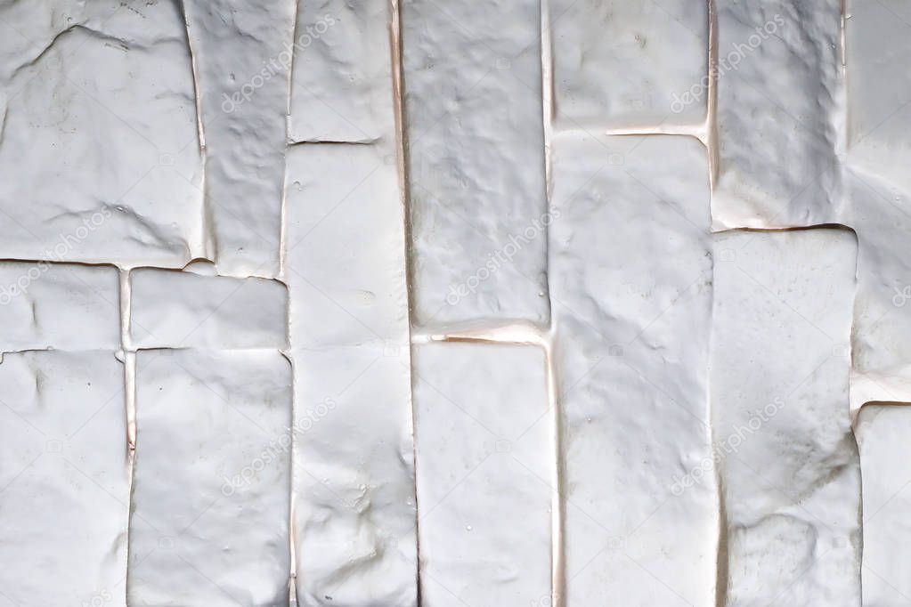 White brick wall plastic panel vertically oriented, may be used as background or texture