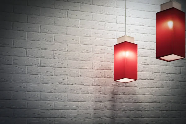 Две Красные Удлиненные Квадратные Подвески Электрические Лампы Против Белой Кирпичной — стоковое фото