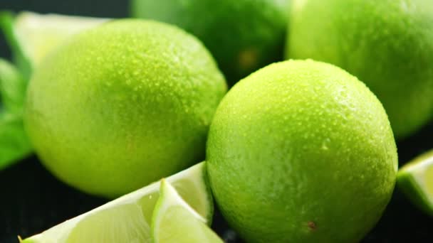 Bright limes with water drops — Stock Video