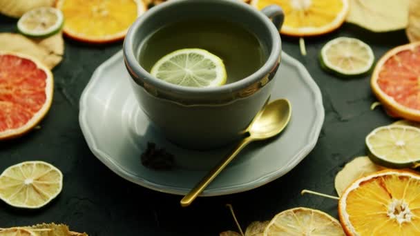Cup of tea with lemon and spoon — Stock Video
