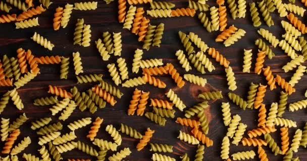 Messy arrangement of pasta on wood — Stock Video