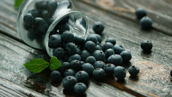 Blueberry scattering out of jug — Stock Photo, Image