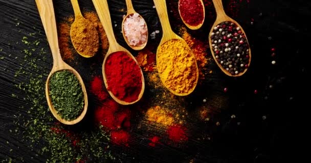 Different types of spices in spoons — Stock Video