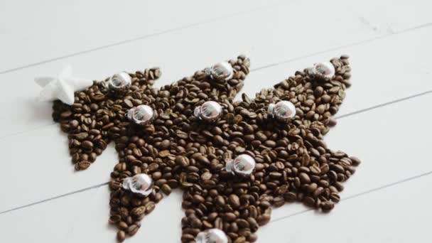 Coffee beans laid in shape of fir — Stock Video