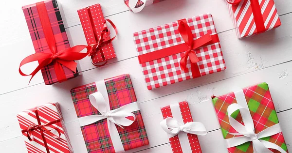 Top view of wrapped Christmas presents laid on the wooden table — Stock Photo, Image