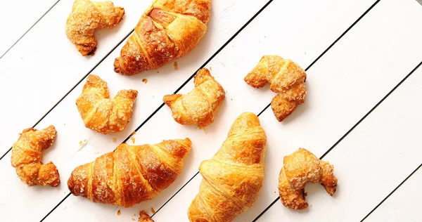 Various croissants lying on table — Stock Photo, Image