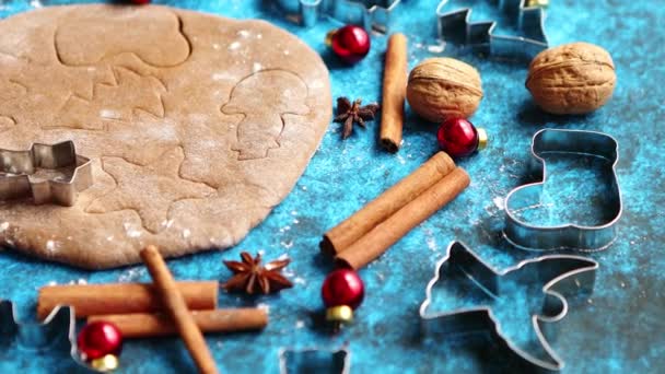 Christmas baking concept. Gingerbread dough with different cutter shapes — Stock Video