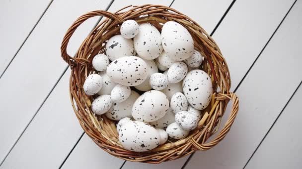 Basket of white dotted Easter eggs in brown wicker basket — Stock Video