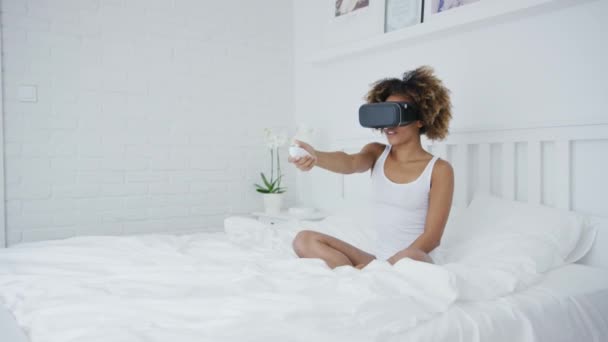 Excited woman gaming in VR glasses — Stock Video