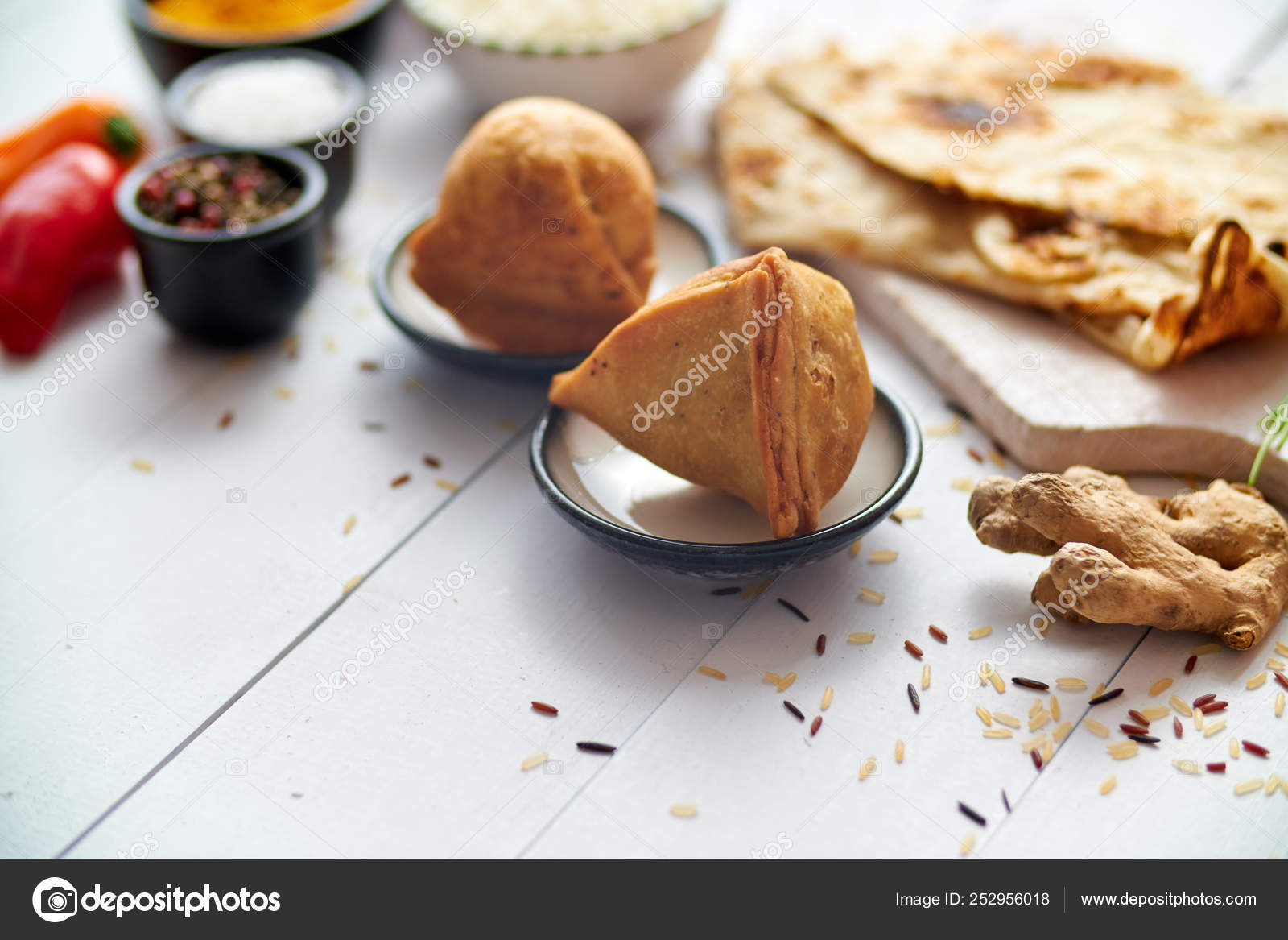 Traditional Indian Food snack Samosa served in a plate on a white