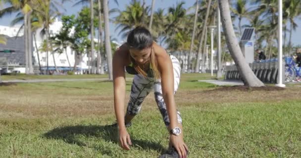 Woman strtching on lawn — Stock Video