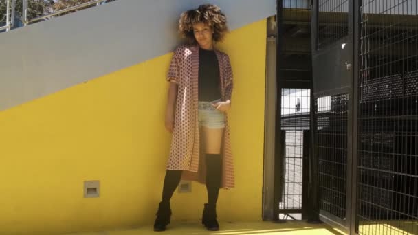 Stylish black woman on street in sunlight Royalty Free Stock Footage