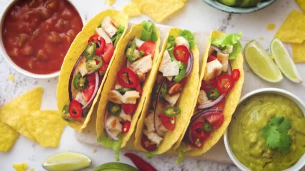 Tasty Mexican meat tacos served with various vegetables and salsa — Stock Video