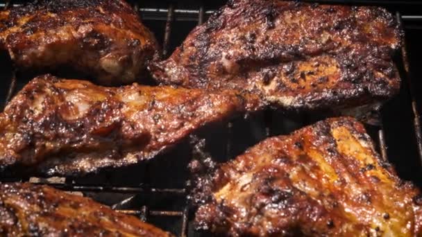 Tasty ribs cooking on barbecue grill for summer outdoor party — Stock Video