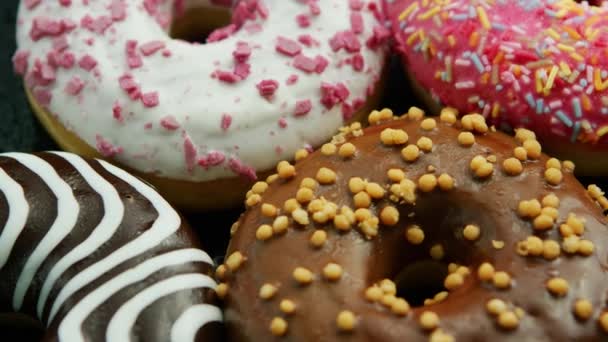 Glazed sweet doughnuts in closeup — Stock Video