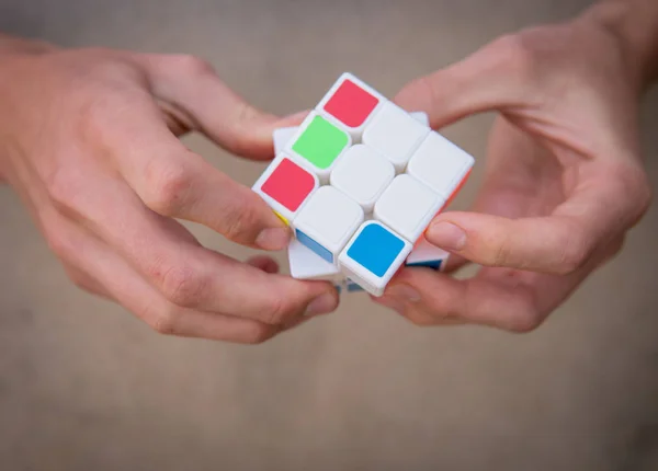 Close Hands Trying Solve Color Cube — Stock Photo, Image