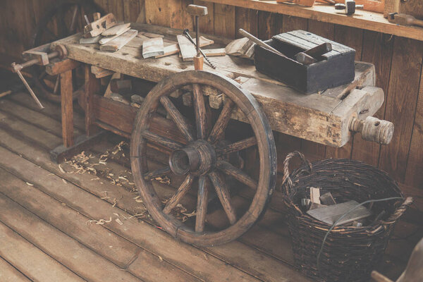 interior of a house with a lot of old parts of a wagon