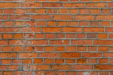 Eski bir kırmızı tuğla duvara yakın çekim