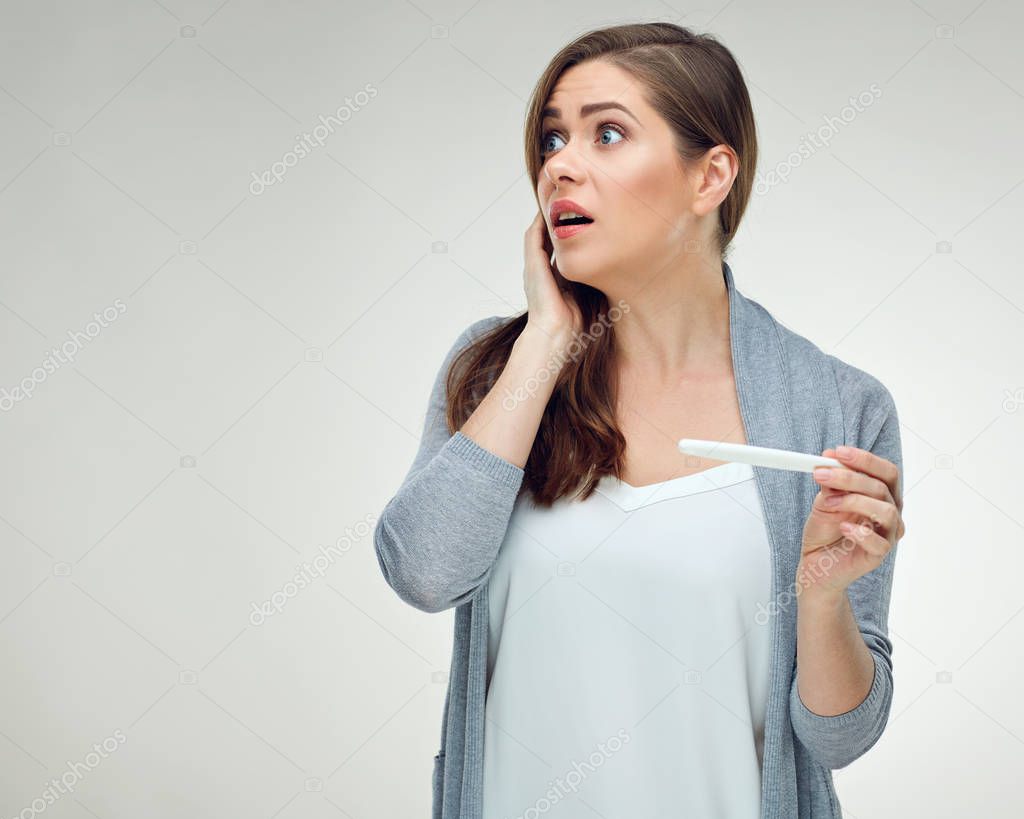 shocked woman holding pregnant test, broken life plan concept  