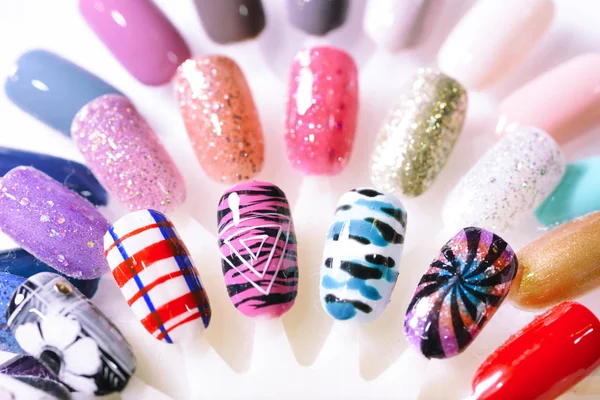 Hand writing nail tips, examples of different colorful nail design