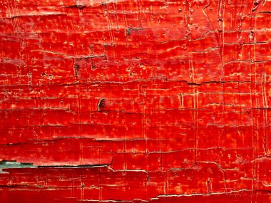 Kırmızı parlak güzel arka plan. Eski bir ahşap tahta üzerinde kırmızı boya kırık.