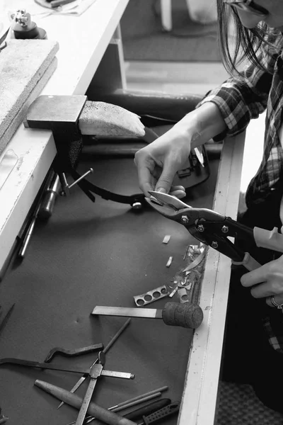 Jeweler at work, crafting in a jewelry workshop.