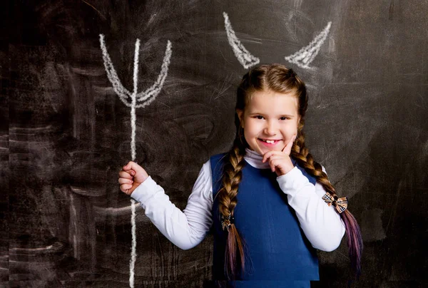 Cute Little Schoolgirl Chalkboard Drawn Horns Devil Trident — Stock Photo, Image