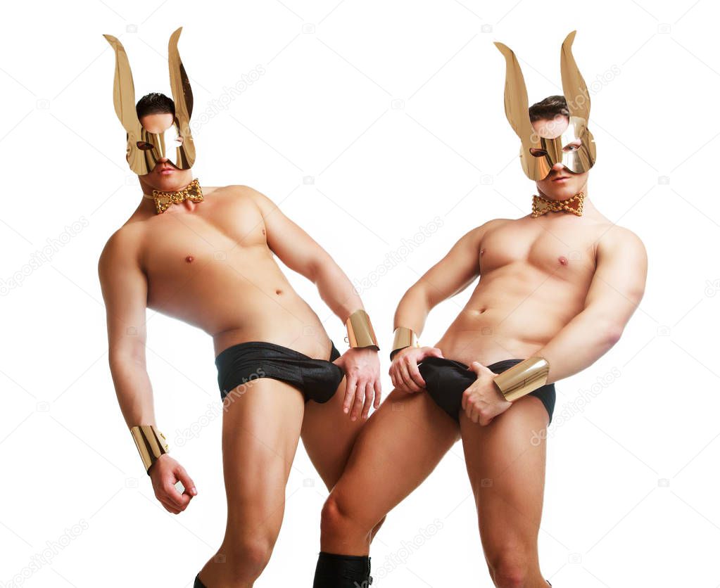 striptease dancer wearing underwear and face mask with rabbit ears in the studio isolated against white background