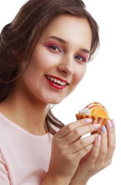 beautiful young model eating dessert, isolated against white background