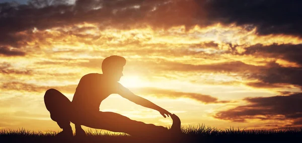 Man Stretching Body Sunset Background — Stock Photo, Image