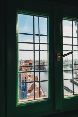 View on Old Town building in Gdansk through window in viewing tower. Poland. clipart