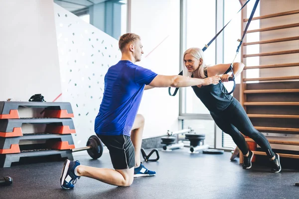 Woman Exercising Personal Trainer Gym Bodybuilding Working Out — Stock fotografie