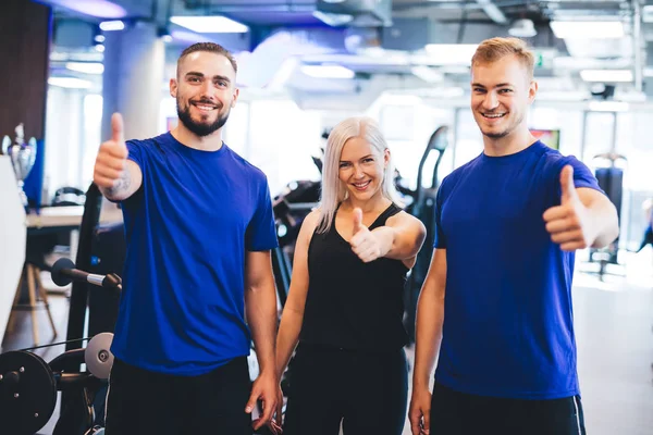 Three Happy People Gym Showing Thumbs Approval Success Gesture — ストック写真