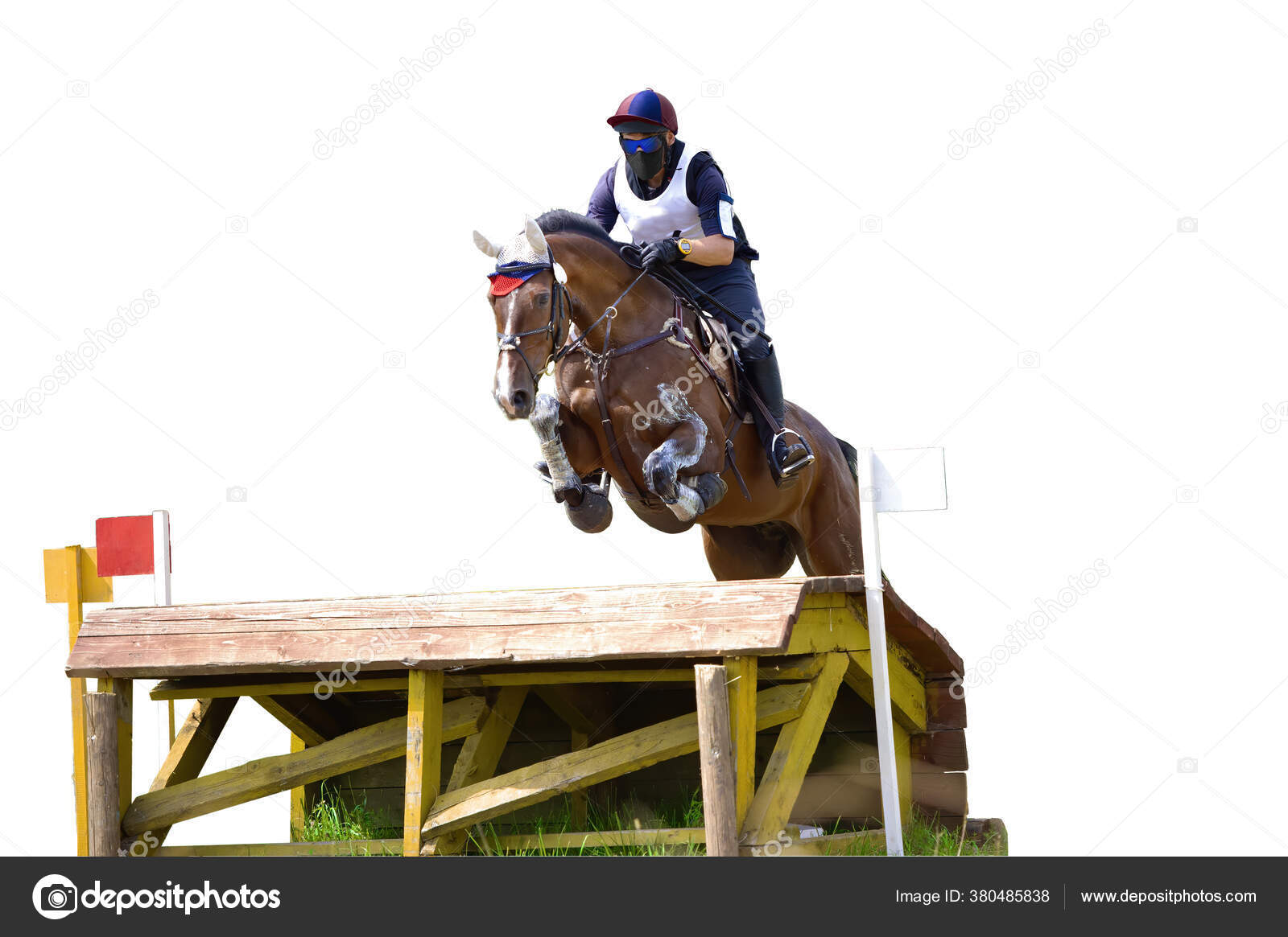 Jockey Com Seu Cavalo Pulando Sobre Um Obstáculo Pulando Sobre O