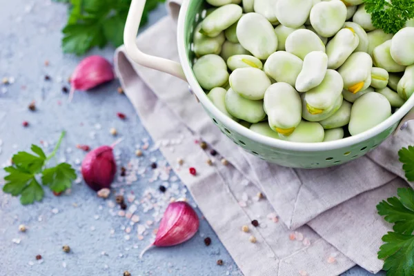 Closeup Strainer Full Fresh Broad Beans Parsley Garlic Placed Napkin — Stock Photo, Image