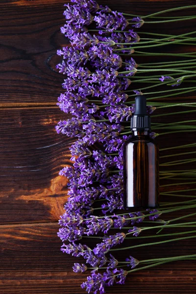 Herbal oil and lavender flowers
