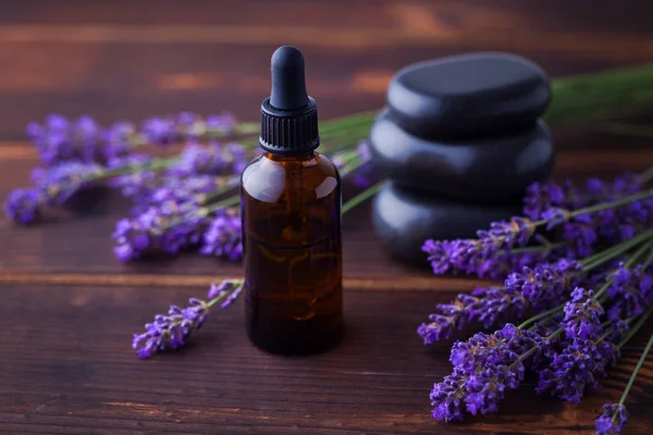 Herbal oil and lavender flowers