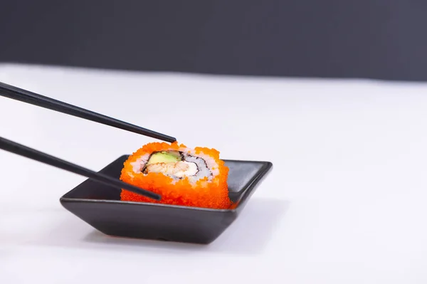 California roll with sticks on a plate Royalty Free Stock Images