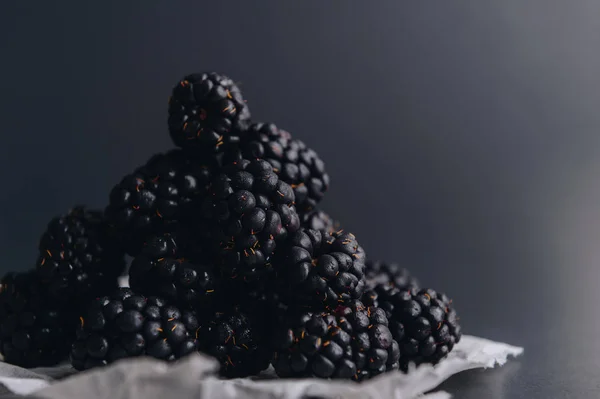 A handful of blackberries on a dark background Stock Image