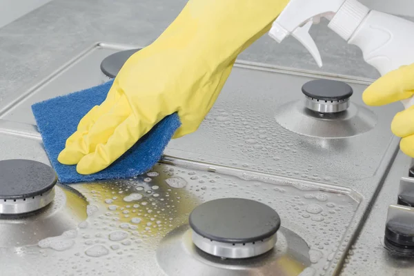 Hands Yellow Gloves Washing Gas Stove Royalty Free Stock Images