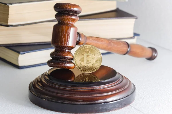 Judges hammer and bitcoin gold coin. Digital currency. Stock Photo