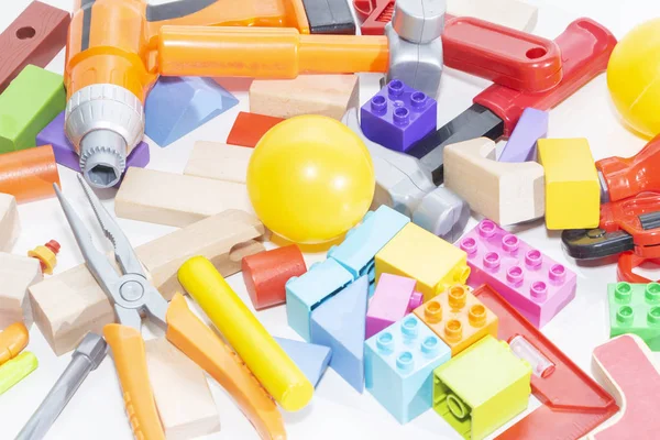 Toy tools and cubes on a light background. Toy for children.