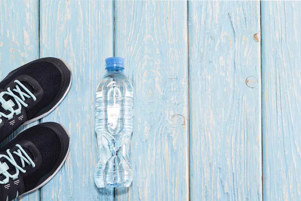 sports shoes, water bottle concept of healthy living, healthy eating, sports and diet