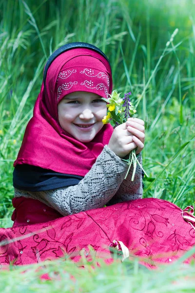 Little Muslim Girl Grass Stock Photo