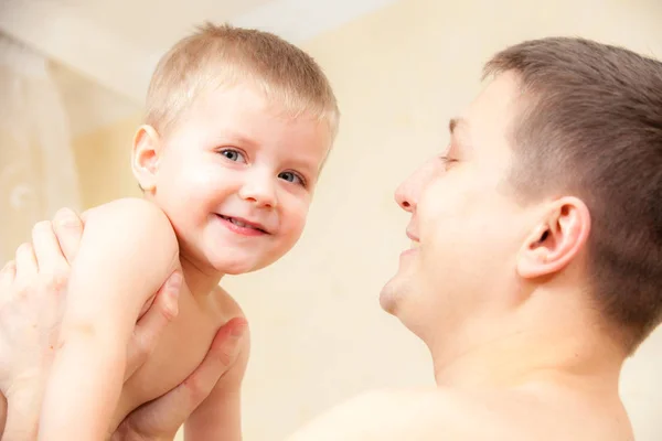 Happy Young Man Holding Smiling Baby — Stock Photo, Image