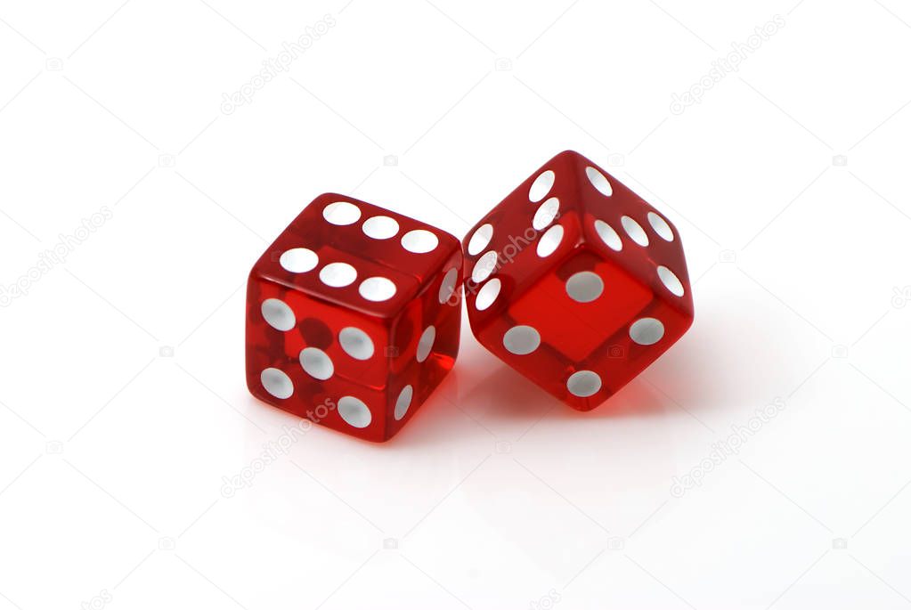 Red dices scattered on white background