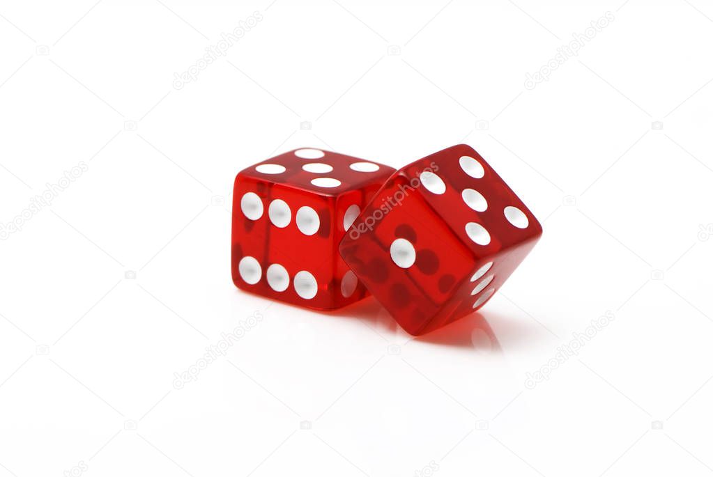 Red dices scattered on white background