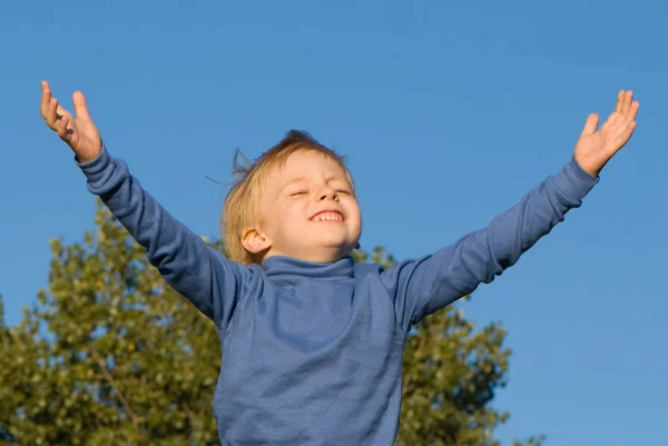 Little Boy Open Hands Raised Blue Sky Background — Stock Photo, Image